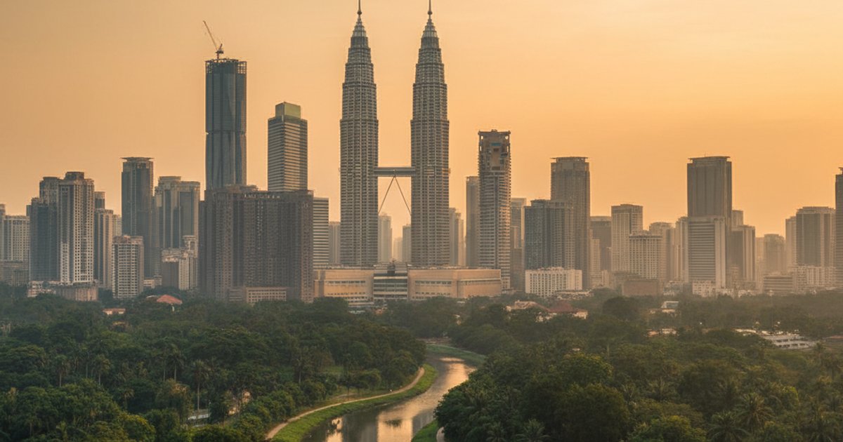 Kuala Lumpur skyline at dusk, showing urban development and natural elements, illustrating MM2H environmental impact